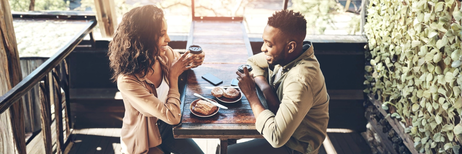 A couple enjoying coffee together at a cosy café